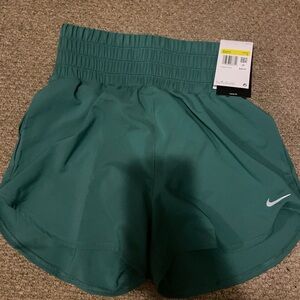 Nike Green Athletic Shorts with Elastic Waistband and Lightweight Fabric